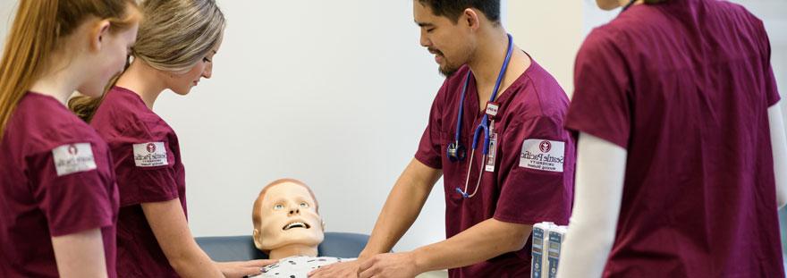 nursing students test on dummy patient